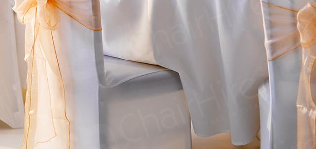 Wedding Furniture Hire https://d1hcs5uofxldvl.cloudfront.net/chair-hire/article_additional/banquet-chair-hire/banquet-chair-hire-740x350.jpg - White wedding & our white linen & bows for a magical look.