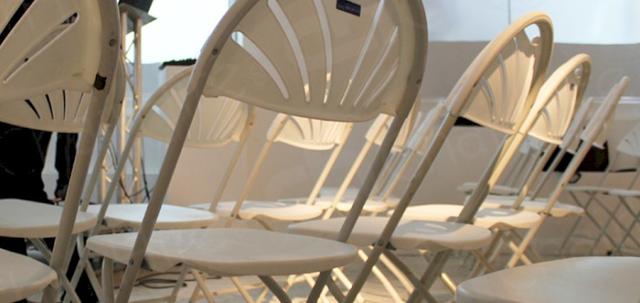 Cloud Meetings https://d1hcs5uofxldvl.cloudfront.net/chair-hire/article_additional/cloud-meetings/cloud-meetings-740x350.jpg - Folding chairs turn empty rooms into meeting areas.