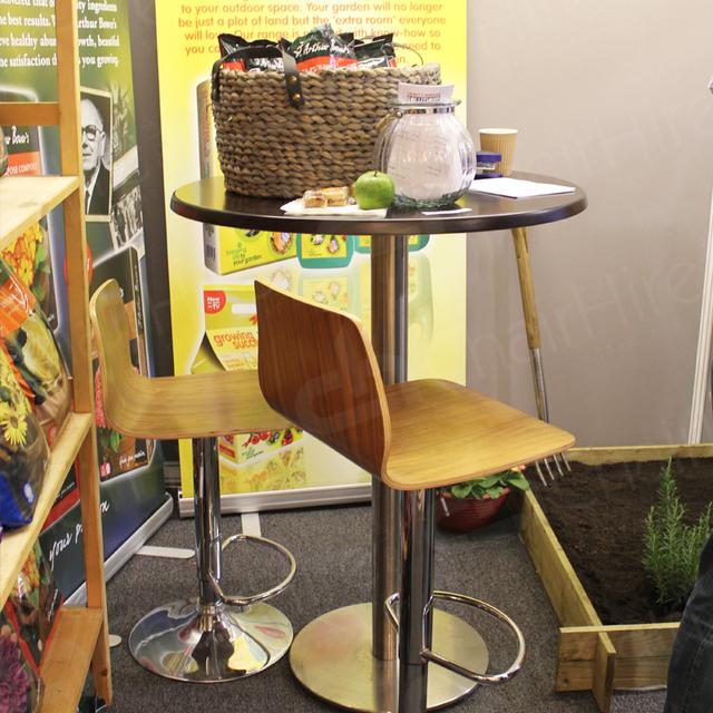 Exhibitions https://d1hcs5uofxldvl.cloudfront.net/chair-hire/article_additional/garden-and-press-event9/garden-and-press-event9.jpg - Ultra contemporary look with walnut poseur tables and stools.