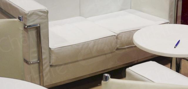 Pro Beauty https://d1hcs5uofxldvl.cloudfront.net/chair-hire/article_additional/pro-beauty-20/pro-beauty-20-740x350.jpg - Modern VIP area with white sofas.