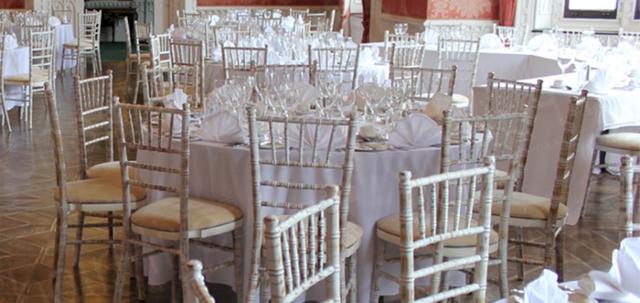 Furniture Hire for Weddings https://d1hcs5uofxldvl.cloudfront.net/chair-hire/article_additional/weddings-at-universities6/weddings-at-universities6-740x350.jpg - Round trestle tables and Chiavaris add to the luxurious ambiance.