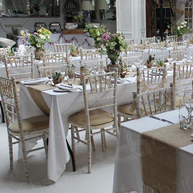 Your Wedding https://d1hcs5uofxldvl.cloudfront.net/chair-hire/article_additional/your-wedding-with-chair-hire8/your-wedding-with-chair-hire8.jpg - Hessian table runners bring out the Chiavaris' limewash finish.