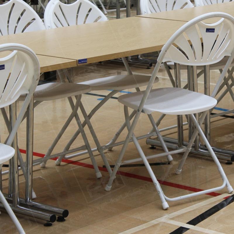 White folding chairs are lightweight and extremely versatile