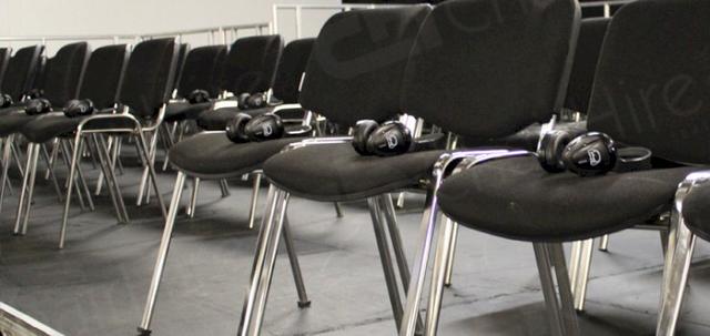 Furniture for Pop Up Cinema https://mill-media.s3.eu-west-2.amazonaws.com/chair-hire/article_additional/pop-up-cinema4/pop-up-cinema4-740x350.jpg - Headphones on every seat for all visitors to enjoy the film.
