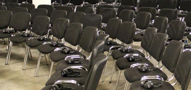 Furniture for Pop Up Cinema https://mill-media.s3.eu-west-2.amazonaws.com/chair-hire/article_additional/pop-up-cinema6/pop-up-cinema6-740x350.jpg - Hire stacking chairs with linking loops.
