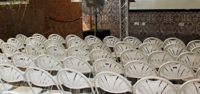 Presentation In The City https://mill-media.s3.eu-west-2.amazonaws.com/chair-hire/article_additional/presentation-in-the-city6/presentation-in-the-city6-740x350.jpg - Folding chairs lined up before the presentation.