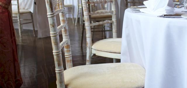 Furniture Hire for Weddings https://mill-media.s3.eu-west-2.amazonaws.com/chair-hire/article_additional/weddings-at-universities/weddings-at-universities-740x350.jpg - Napkins add to the elegance provided by Chiavari seating.