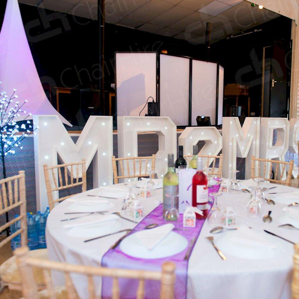 The new Mr & Mrs with the help of Chair Hire.