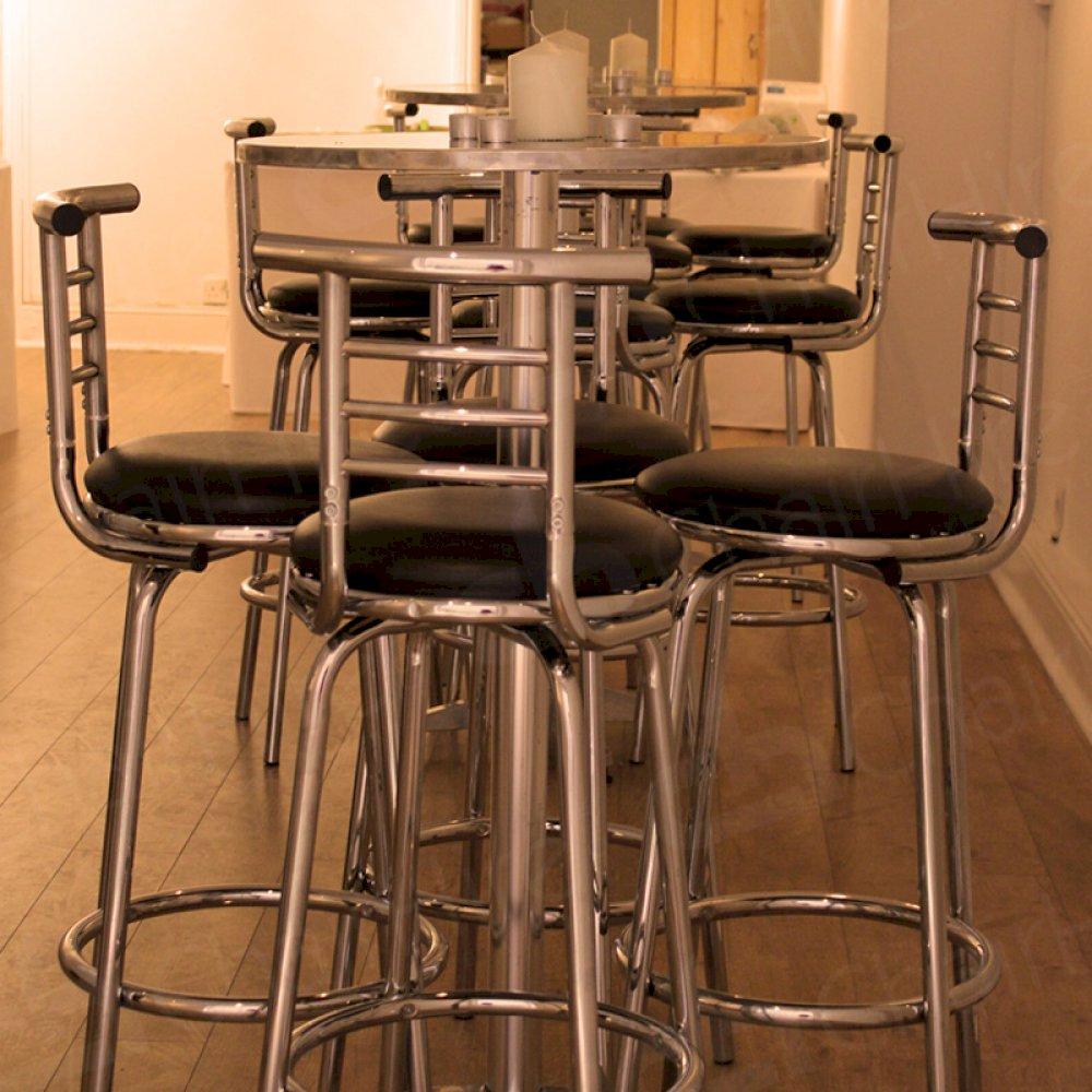 Poseur tables and high back stools can be used indoor or outdoor. Very versatile.