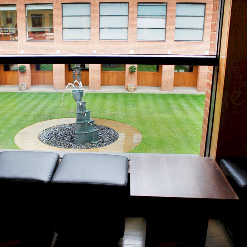 Walnut coffee tables and cube seating for other areas of your seminar/event.
