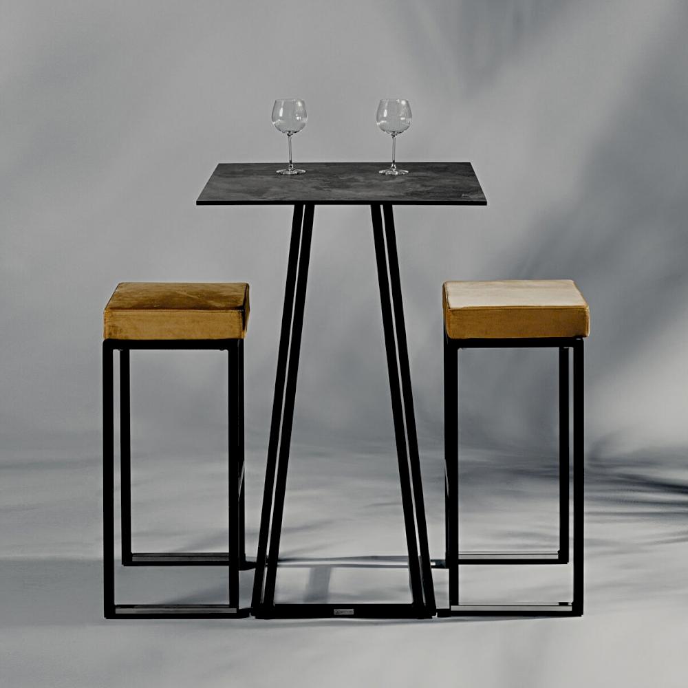 Featured: Black, square Dallas poseur table paired with Nevada stools and gold pads.