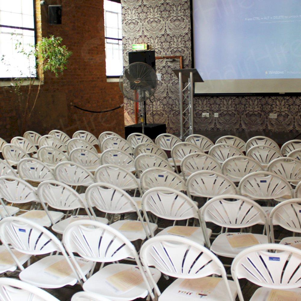 Folding chairs lined up before the presentation.