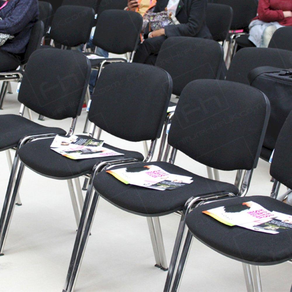 Black conference chairs installed for ProHairLive seminars.