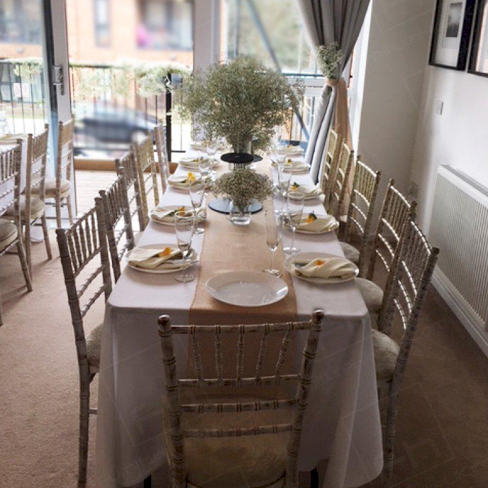 Choosing to hire Limewash Chiavari Chairs and trestle tables when hosting your own baby shower.