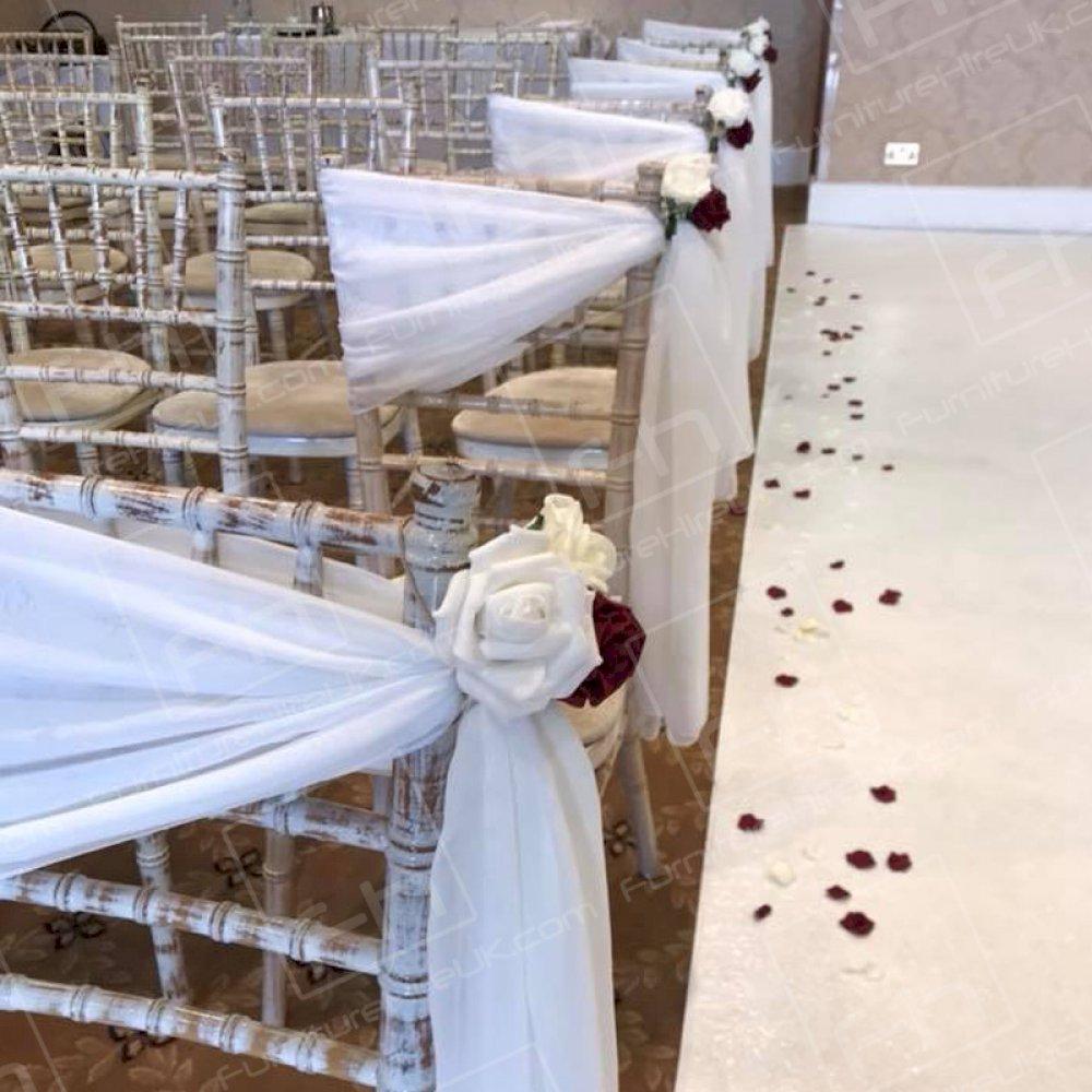 Beautifully decorated Chiavari chairs at an elegant Spring wedding.